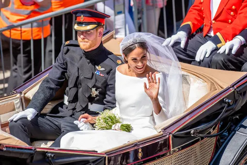 Принц Гарри и Меган Маркл после королевской свадебной церемонии, 2018 год.
